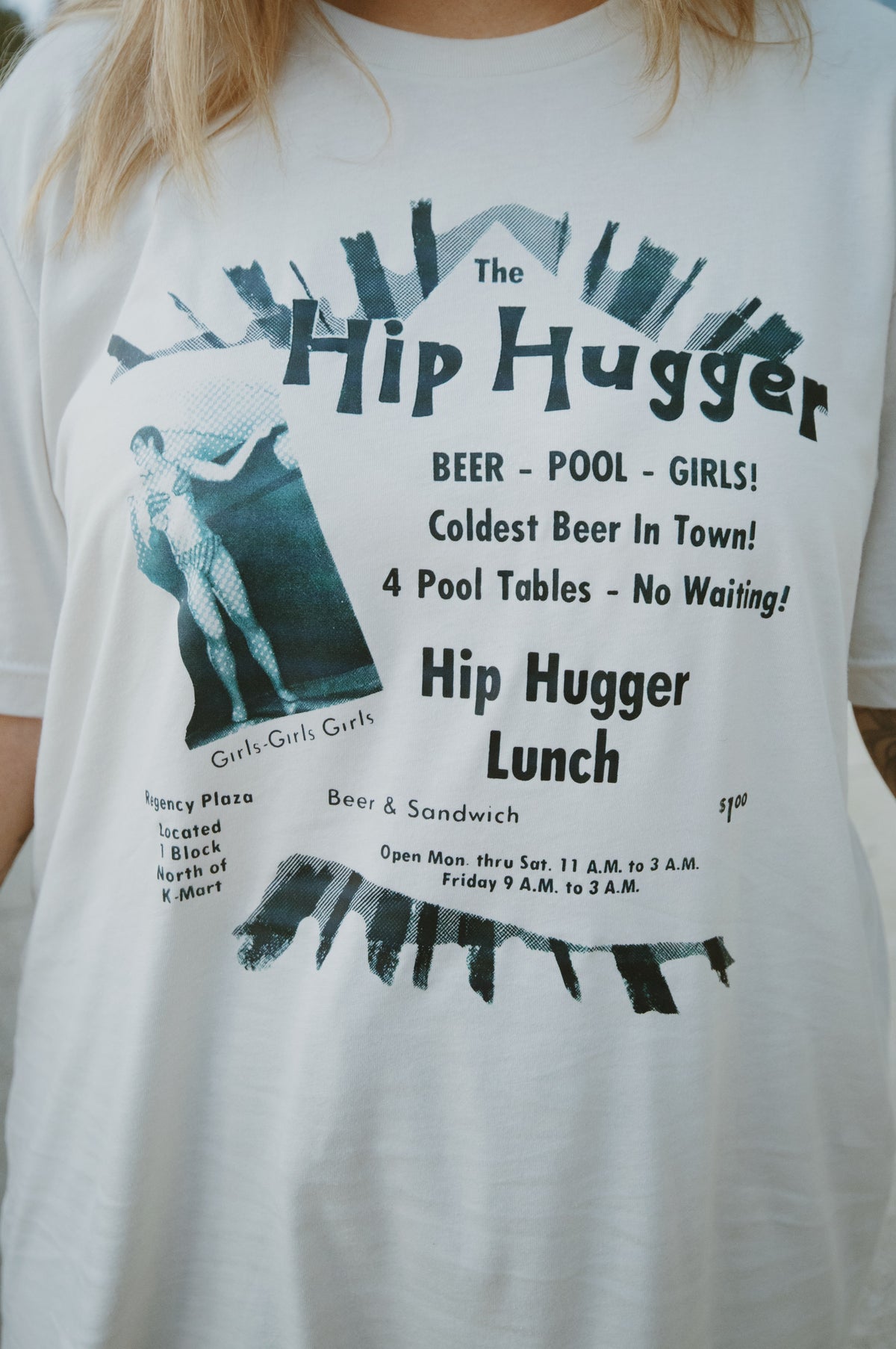 Close-up of the vintage Hip Hugger advertisement print on the front of the tee