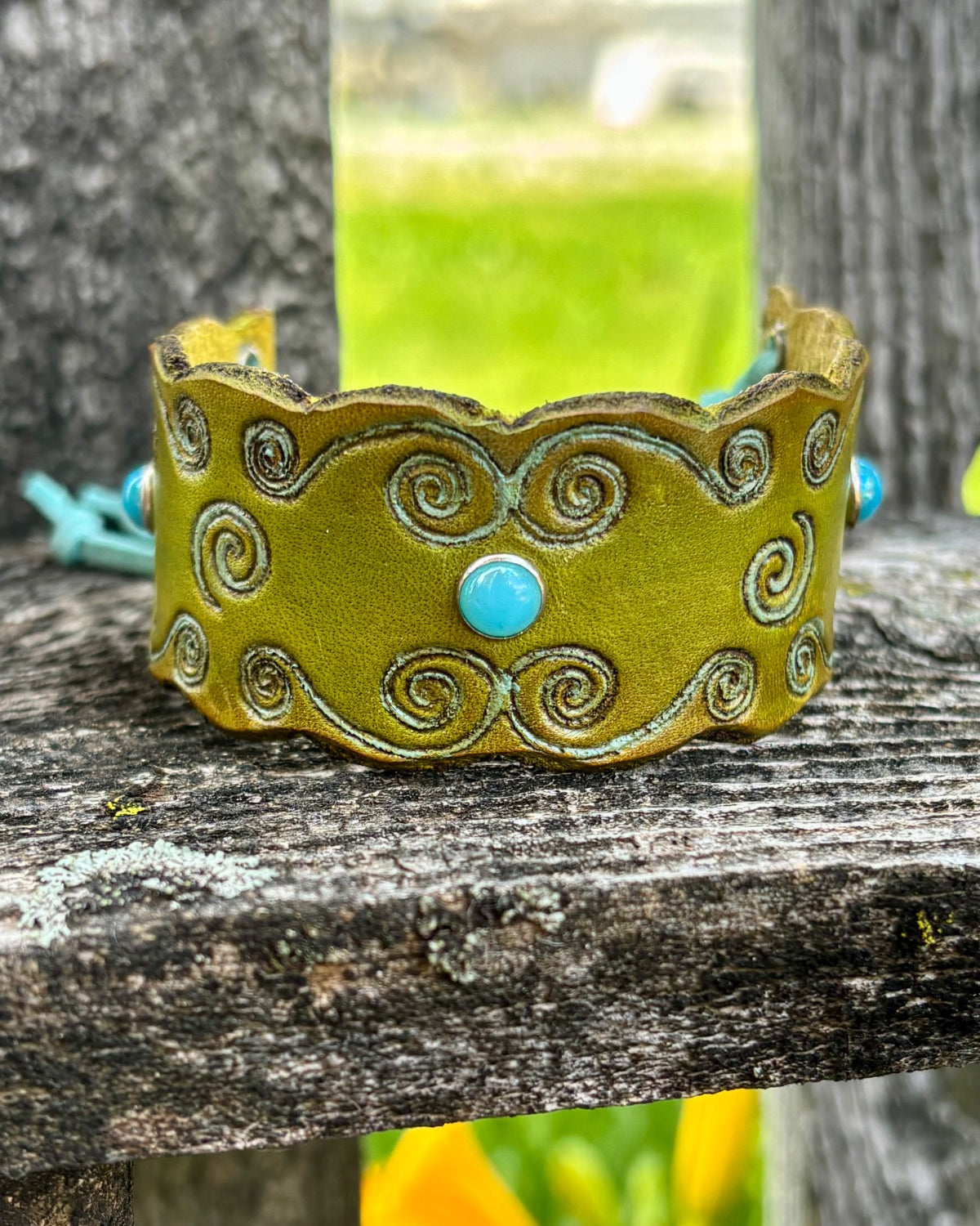 Olive green leather cuff bracelet with turquoise cabochons and swirl tooling by Angie Meyers Designs