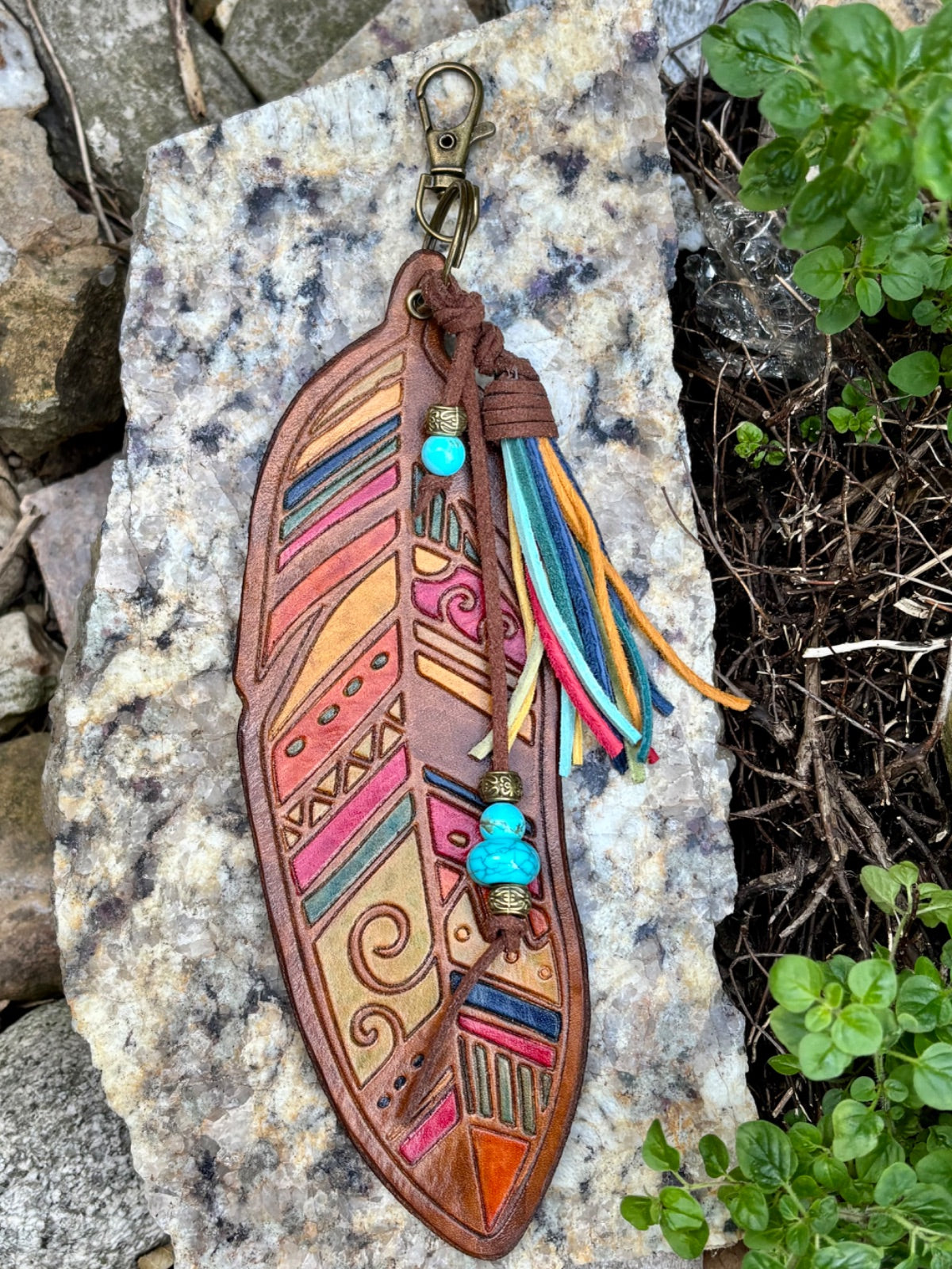 Large hand-tooled leather feather bag charm with turquoise beads and a suede tassel by Angie Meyers Designs