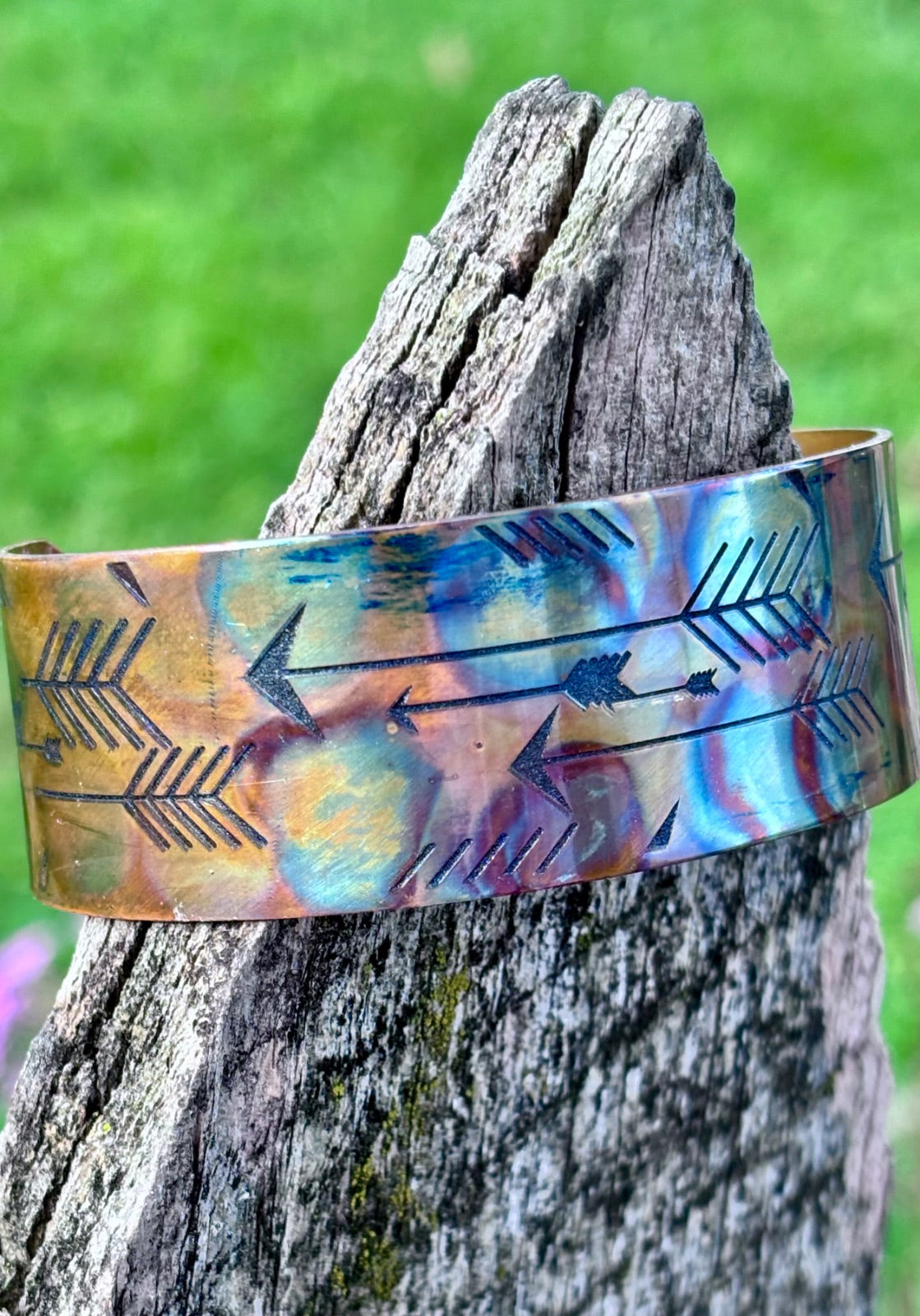 Close-up of mens fire-painted copper cuff bracelet texture