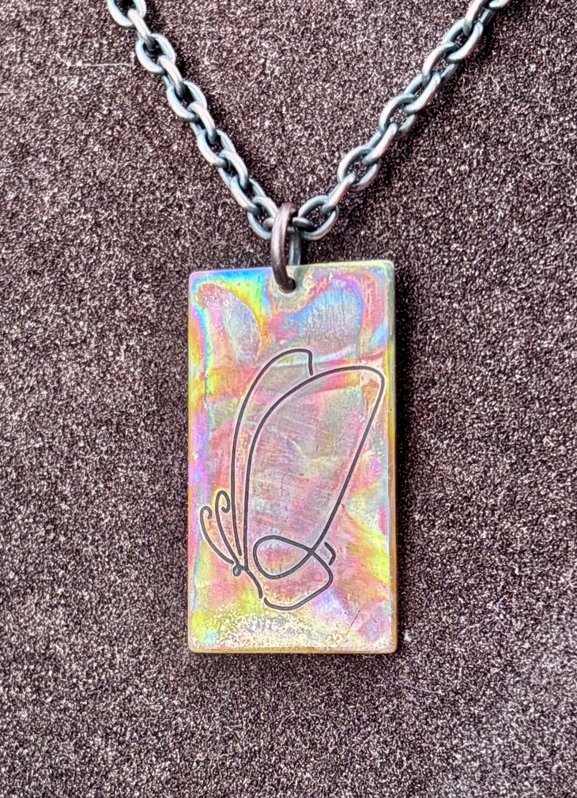 Fire painted copper rectangle pendant detail, side angle