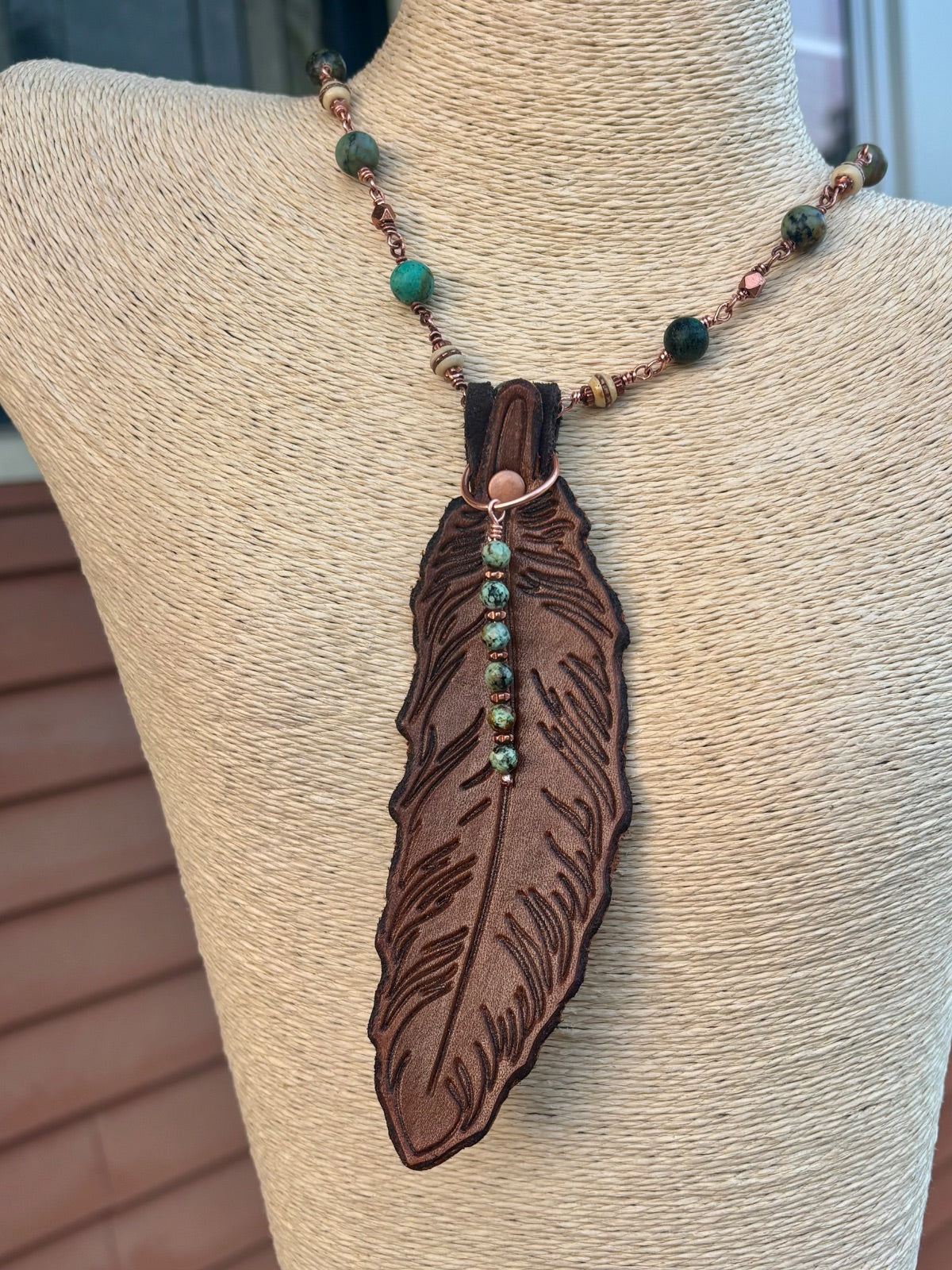 Necklace worn without leather feather pendant, beaded strand only