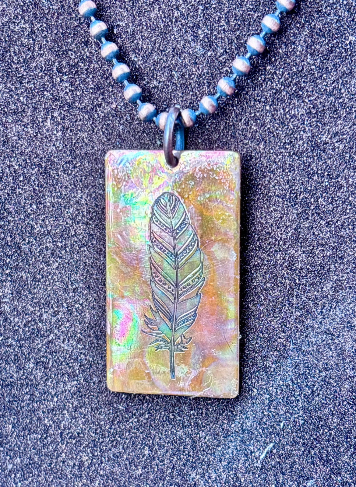 Back view of fire painted copper rectangle pendant
