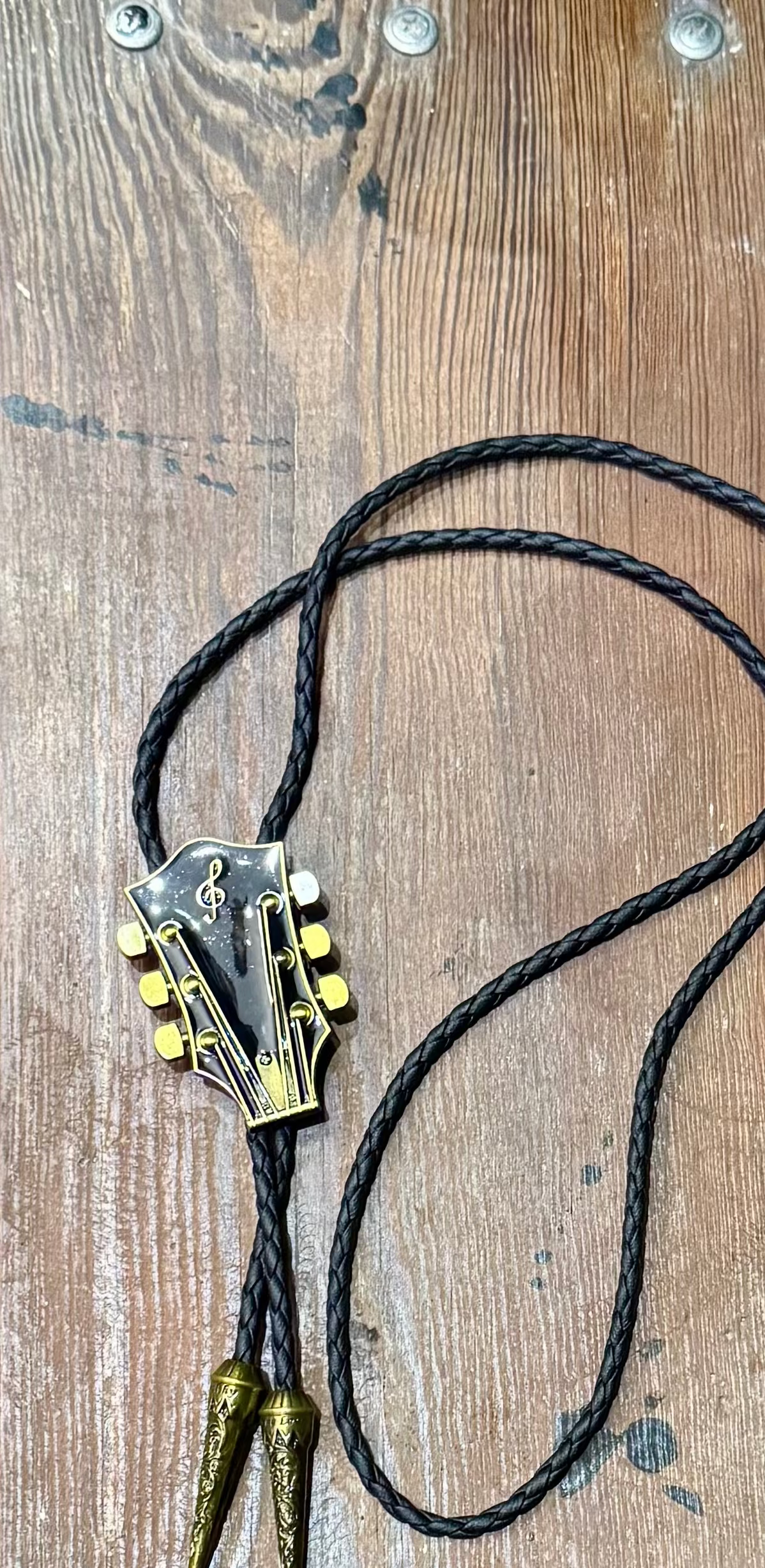Corded  Brass Guitar Headstock Bola – Boho Charm for the Free Spirit - The Elevated Hippie