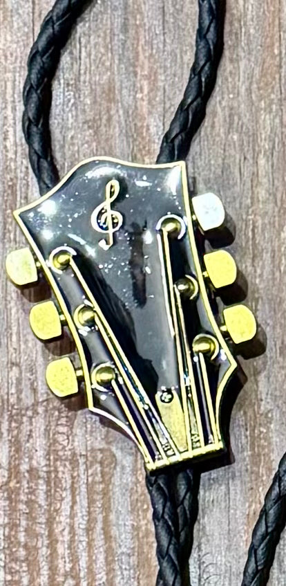 Corded  Brass Guitar Headstock Bola – Boho Charm for the Free Spirit - The Elevated Hippie