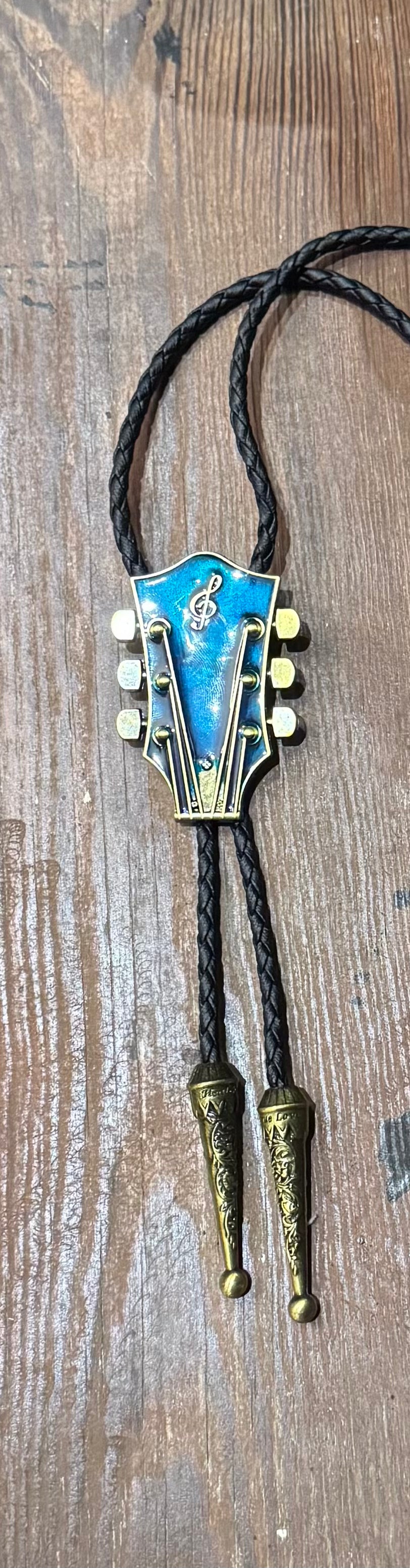 Corded  Brass Guitar Headstock Bola – Boho Charm for the Free Spirit - The Elevated Hippie