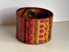 Wide hand-painted tribal leather cuff bracelet in pink, orange, and purple by Angie Meyers Designs