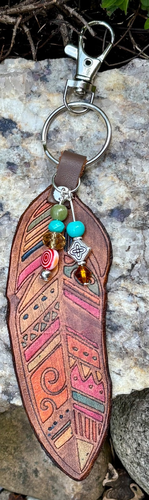 Hand-tooled leather feather bag charm with turquoise and glass beads by Angie Meyers Designs