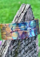 Close-up of mens fire-painted copper cuff bracelet texture