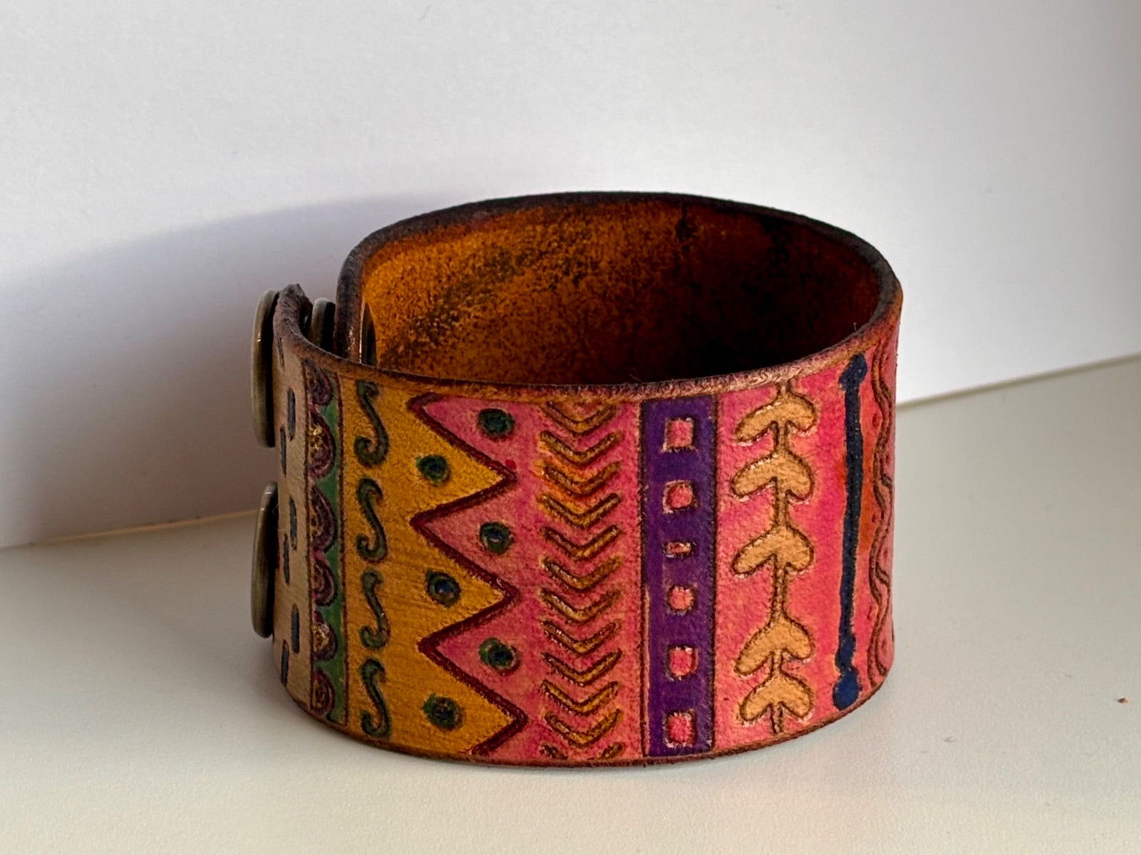 Wide tribal leather cuff bracelet interior view showing double-snap closure