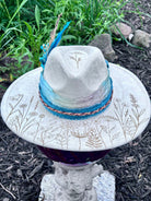 Close-up of laser-engraved dandelion design on rancher hat brim