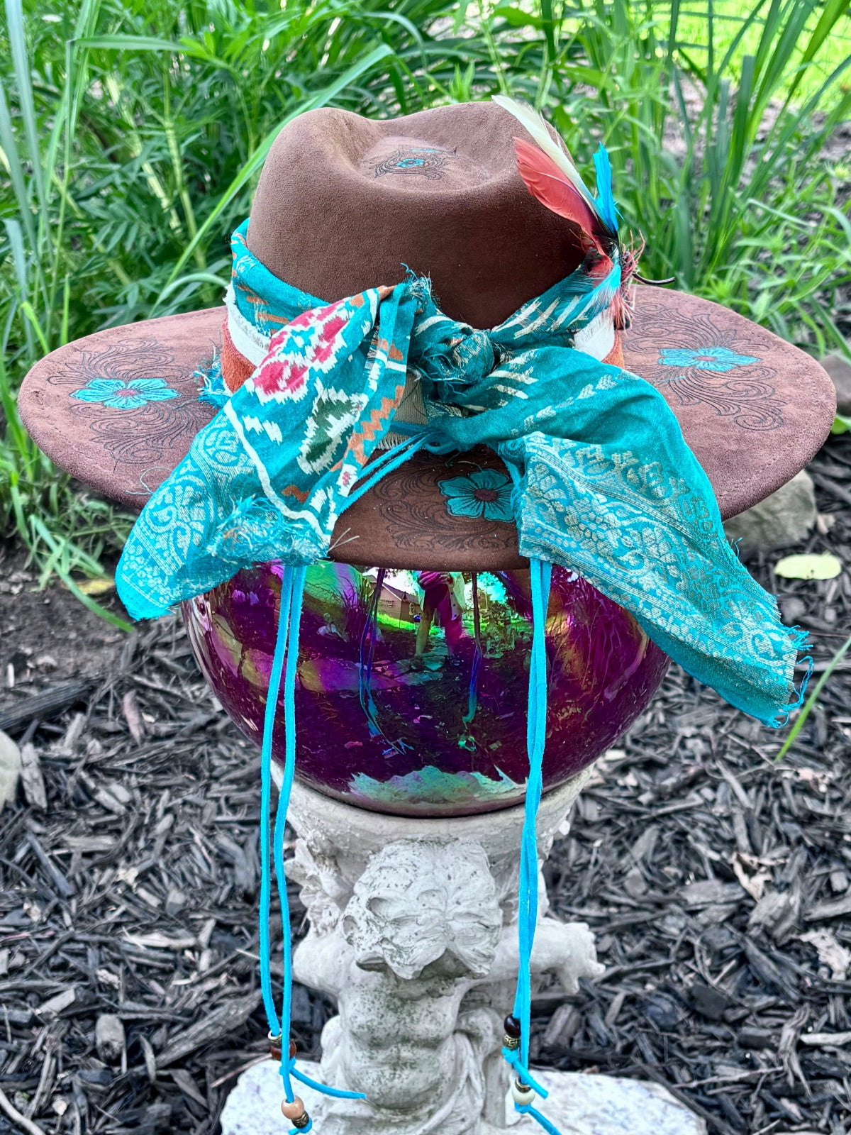 Side view of brown vegan suede rancher hat with turquoise flowers