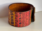 Wide tribal leather cuff bracelet side view showing tooled pattern detail