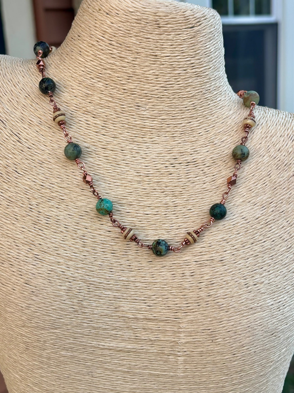 Turquoise and copper beaded necklace detail