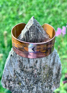 Side view of fire painted copper cuff bracelet