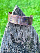 Fire painted copper cuff bracelet, top-down view