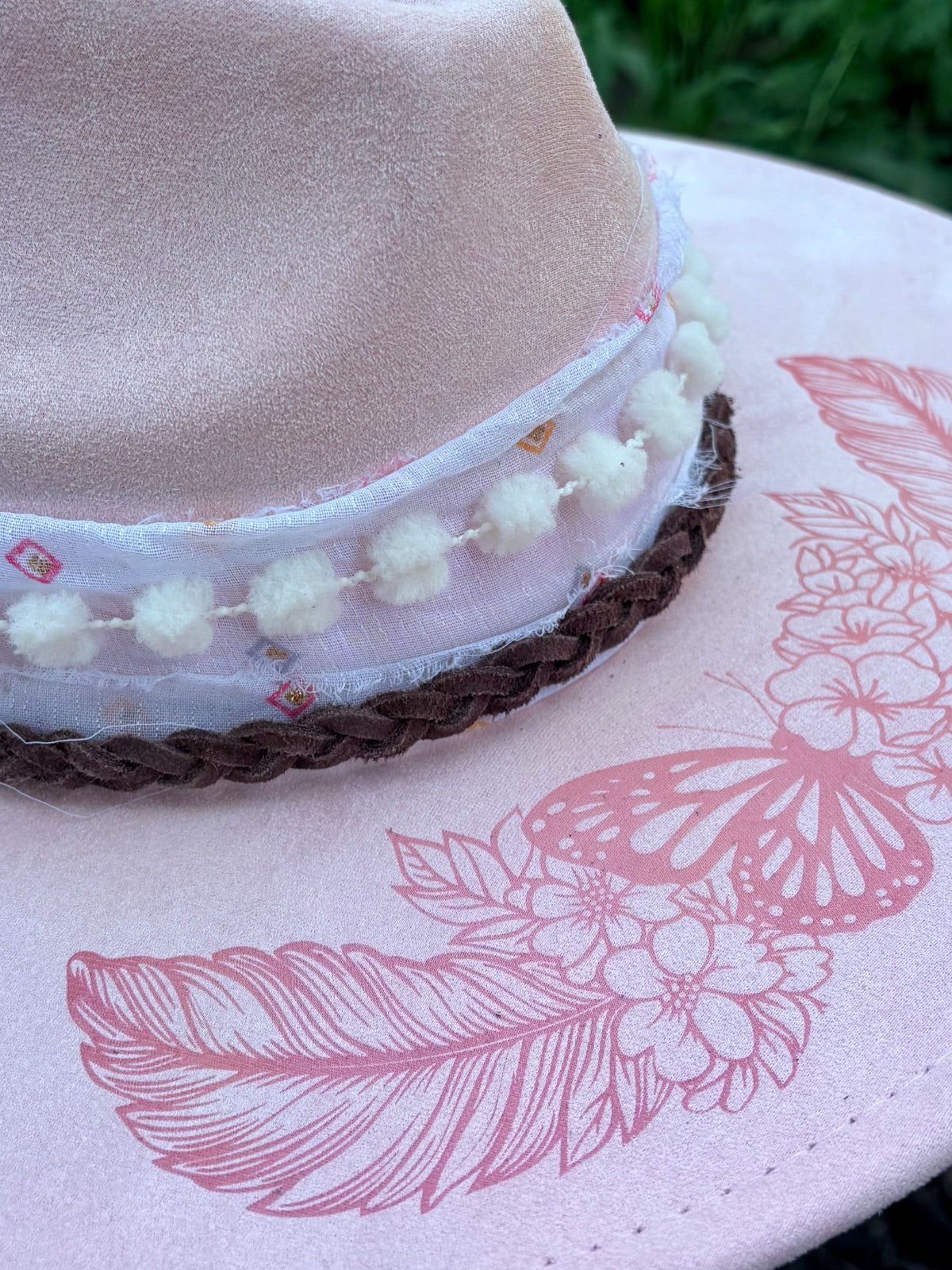 Layered hatband detail on pink butterfly rancher hat