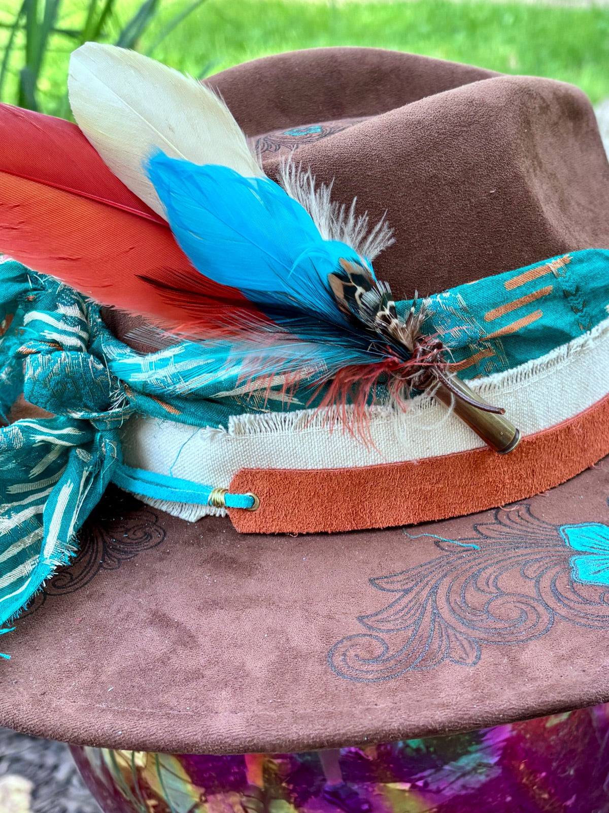 Brim edge detail on turquoise flower rancher hat